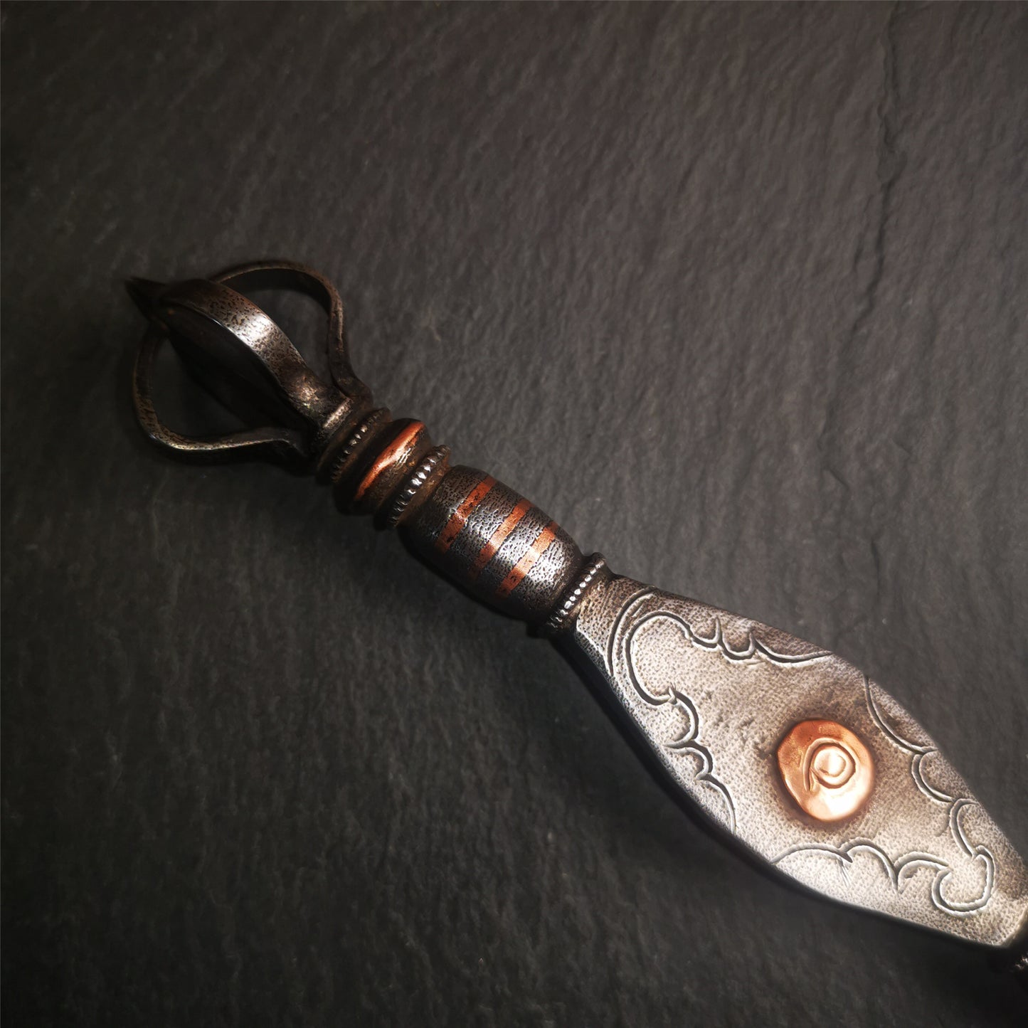 This vajra sword was handmade by Tibetan craftsmen from Tibet in 1990s,from Hepo Town, Baiyu County.  It's a manjusri sword shape,flame shape blade,made of cold iron, carved conch pattern,and the vajra of the tail hanging ring