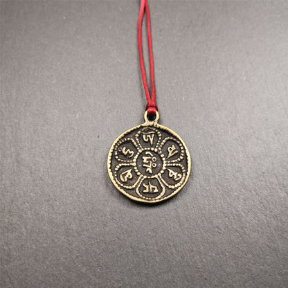 This om badge was made by Tibetan craftsmen and come from Hepo Town, Baiyu County, the birthplace of the famous Tibetan handicrafts. It is round, made of brass or white copper, 1.26 inches,carved with mantra of chenrezig OM MANI PADME HUM.