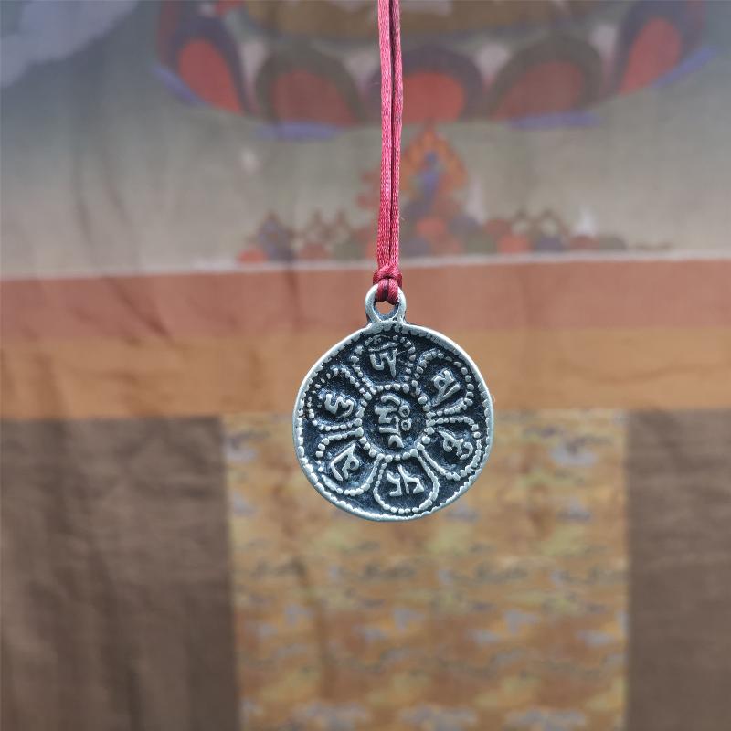 This om badge was made by Tibetan craftsmen and come from Hepo Town, Baiyu County, the birthplace of the famous Tibetan handicrafts. It is round, made of brass or white copper, 1.26 inches,carved with mantra of chenrezig OM MANI PADME HUM.