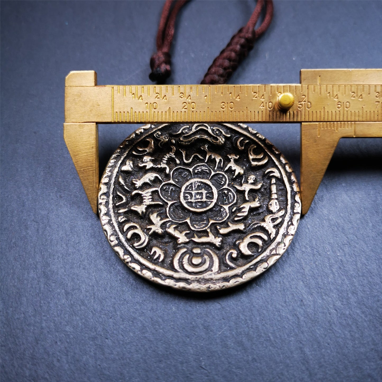 This unique Melong badge was collect from Kathok Monastery Tibet,about 60+ years old.It was sacred  amulets used by Kathok Monastery to present to believers,during a grand Dharma gathering,consecrated and blessed by lama.  It is made of thokcha,2.16 inch diameter,the front pattern is Tibetan Budhist calendar symbol - SIPAHO.