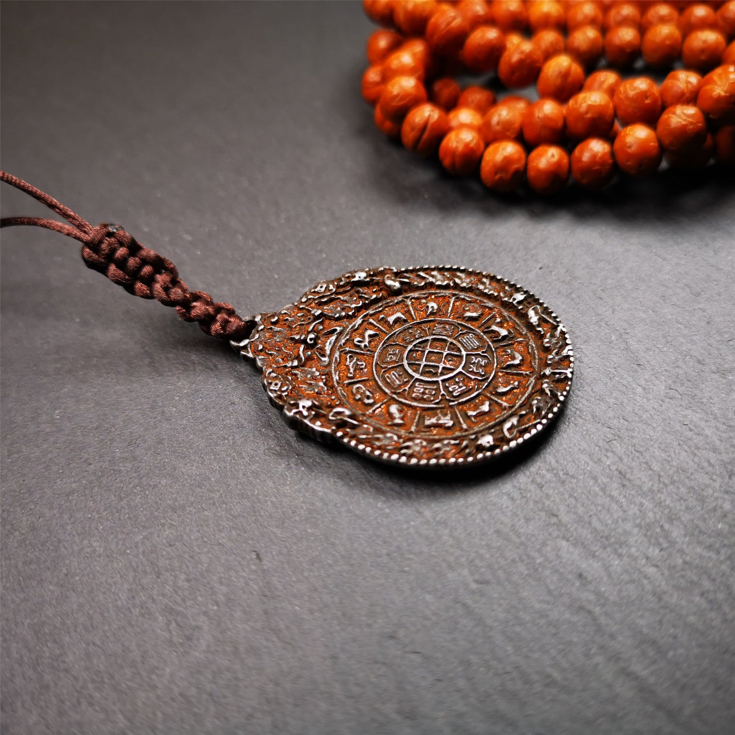 This unique melong badge was collected from Rejia Monastery,it was sacred amulets used present to believers,during a grand Dharma gathering,consecrated and blessed by lama. It is made of cold iron and 2 sided patterns.The front is Tibetan Budhist amulet symbol - SIPAHO,the back is cross vajra pattern and Ashtamangala