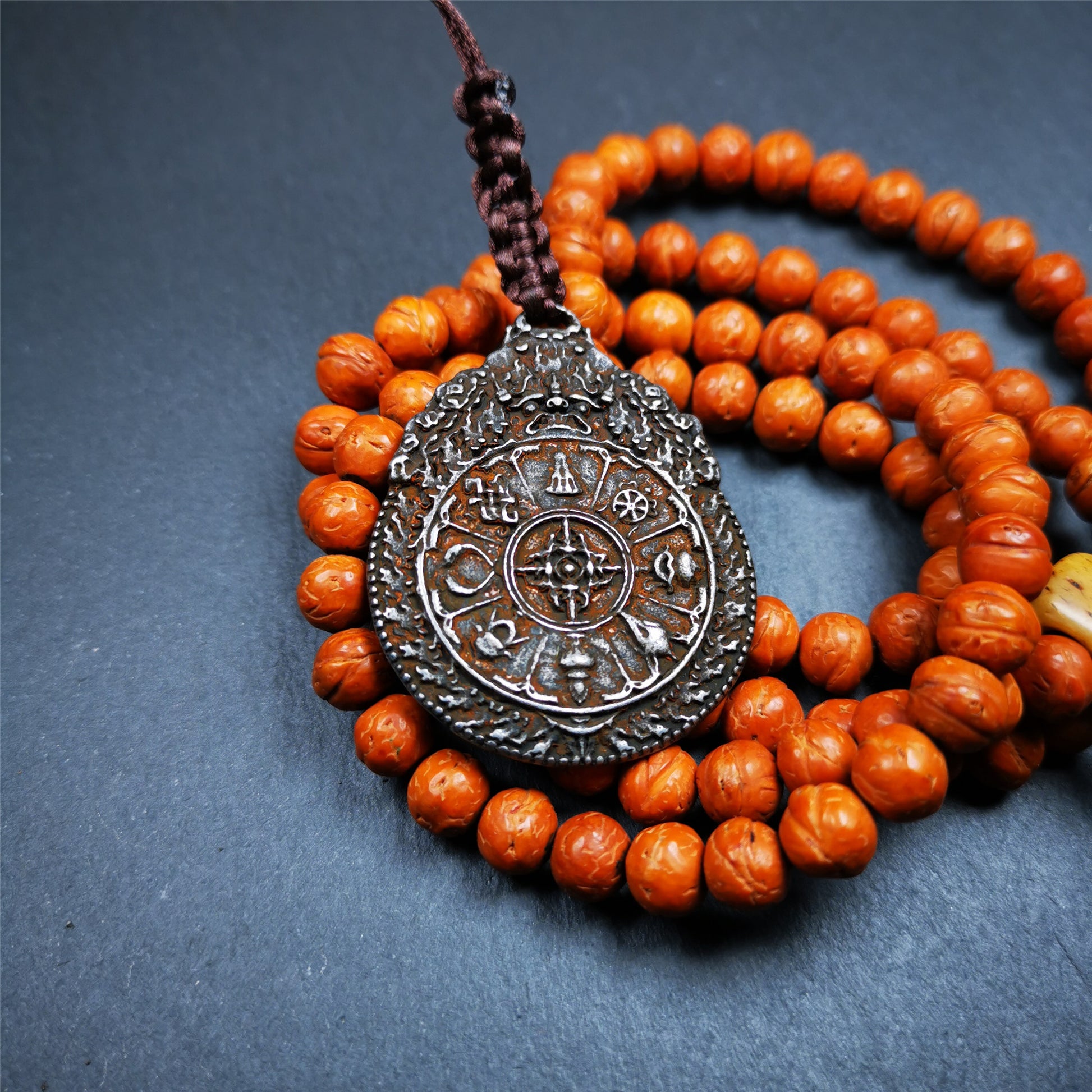 This unique melong badge was collected from Rejia Monastery,it was sacred amulets used present to believers,during a grand Dharma gathering,consecrated and blessed by lama. It is made of cold iron and 2 sided patterns.The front is Tibetan Budhist amulet symbol - SIPAHO,the back is cross vajra pattern and Ashtamangala