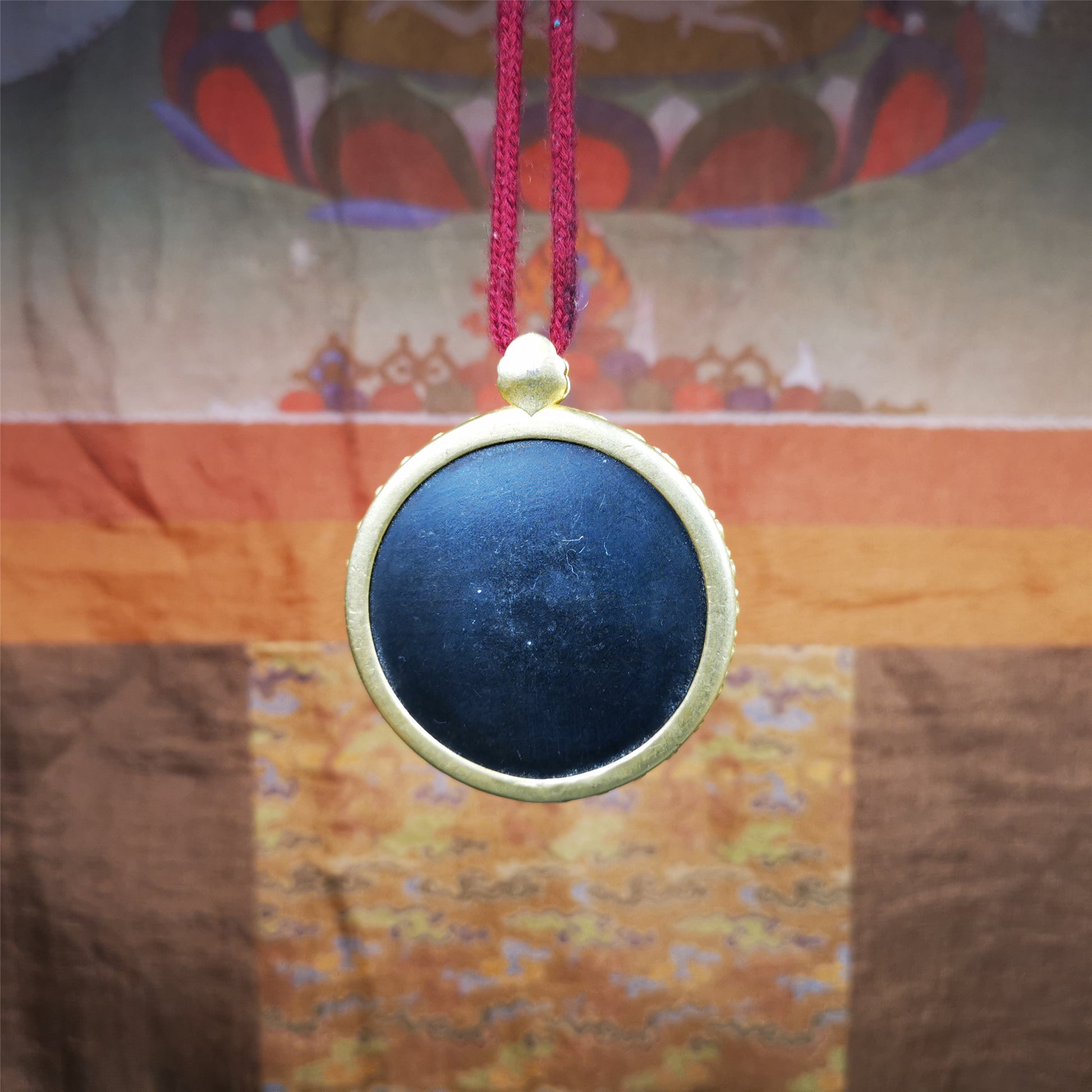 This badge is made by Tibetan craftsmen and come from Hepo Town, Baiyu County,Tibet. It is made of thokcha, edging with copper,round shape, 2.52 inche diameter. The OM MANI PADME HUM mantra arranged in concentric circles.