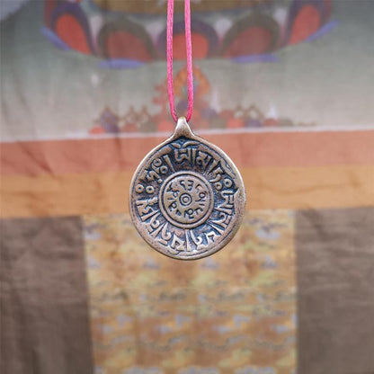 This Om badge amulet was collected from Yushu City Tibet,about 50 years old. It is round shape,made of lima brass, 1.46 inches,carved with mantra of chenrezig OM MANI PADME HUM. You can make it into a necklace, or a keychain, pendant
