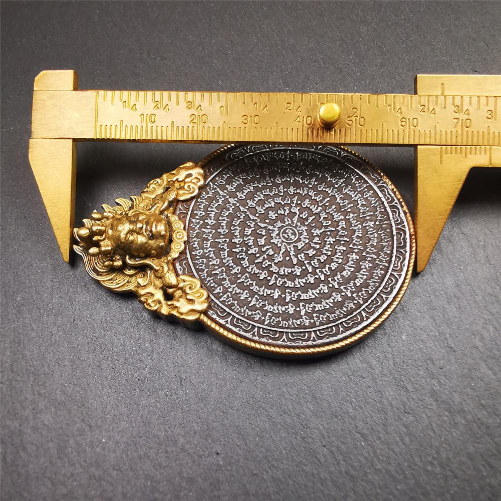 This type of tibetan mantra badge amulet was made by Tibetan craftsmen and come from Hepo Town, Baiyu County, Tibet.It is made of cold iron,grey color,carved mantra of Om Mani Padme Hum  It adopts a split casting method, the shell is Mahakala.