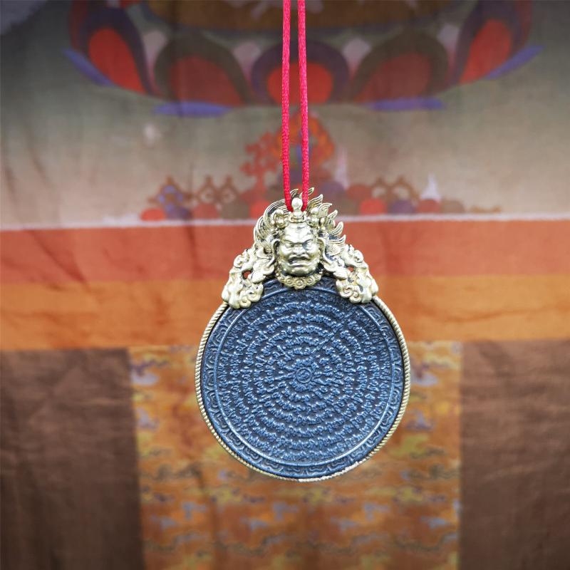 This type of tibetan mantra badge amulet was made by Tibetan craftsmen and come from Hepo Town, Baiyu County, Tibet.It is made of cold iron,grey color,carved mantra of Om Mani Padme Hum  It adopts a split casting method, the shell is Mahakala.