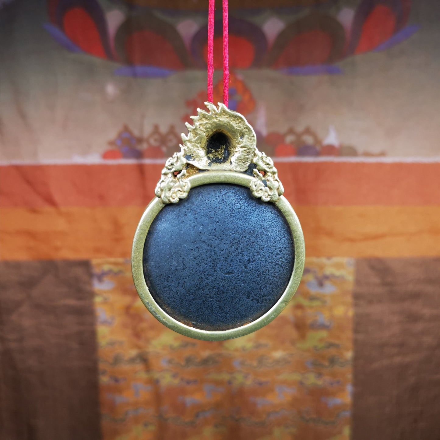 This type of tibetan mantra badge amulet was made by Tibetan craftsmen and come from Hepo Town, Baiyu County, Tibet.It is made of cold iron,grey color,carved mantra of Om Mani Padme Hum  It adopts a split casting method, the shell is Mahakala.