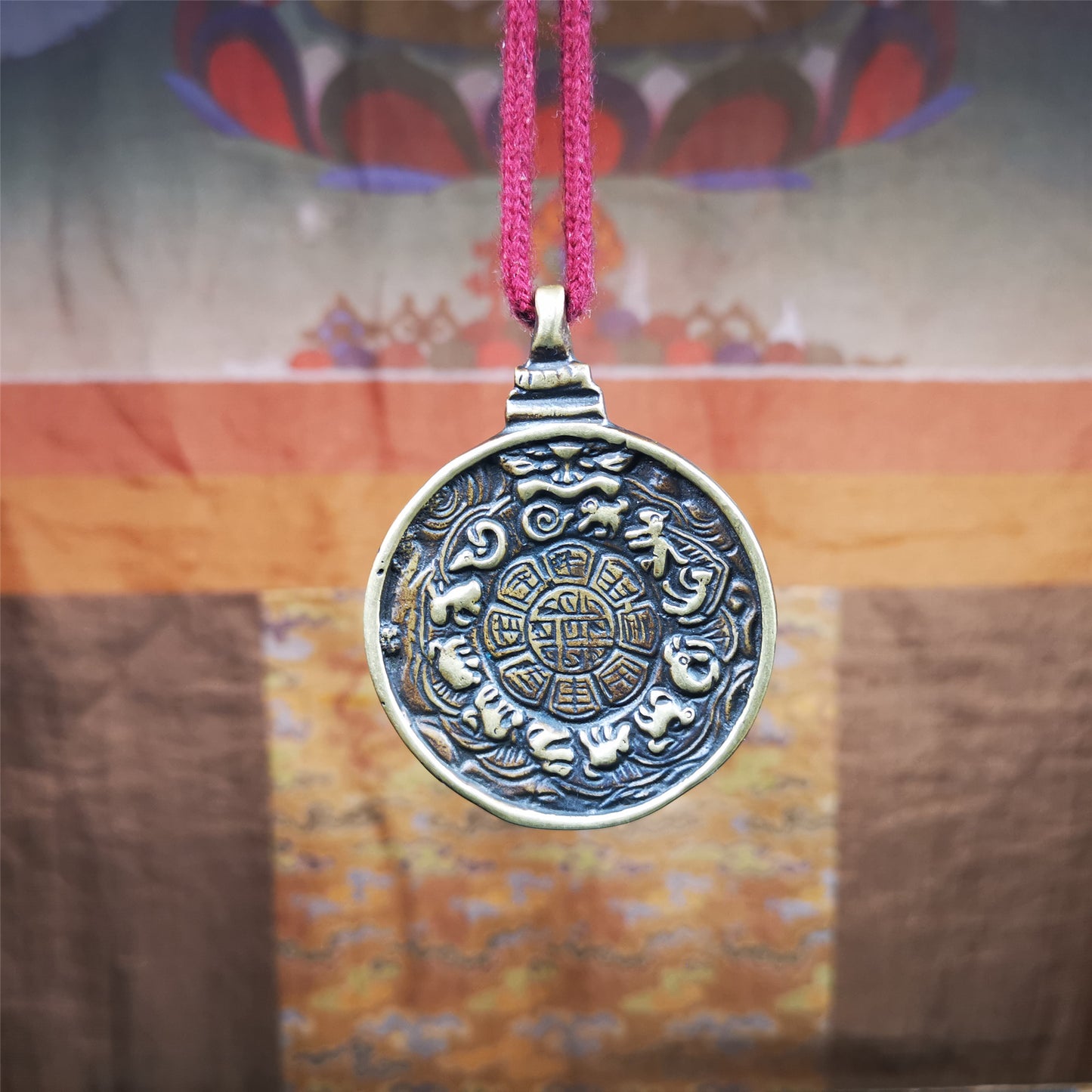 This unique Manjusri Melong Amulet was collected from Kathok Monastery,about 40 years old,bless by lama. It is round shape,made of brass,2.28 inch diameter.The front pattern is Tibetan Budhist calendar symbol - SIPAHO(srid pa ho),the back is Manjusri . You can make it into pendant or keychain, or just put it on your desk,as an ornament.