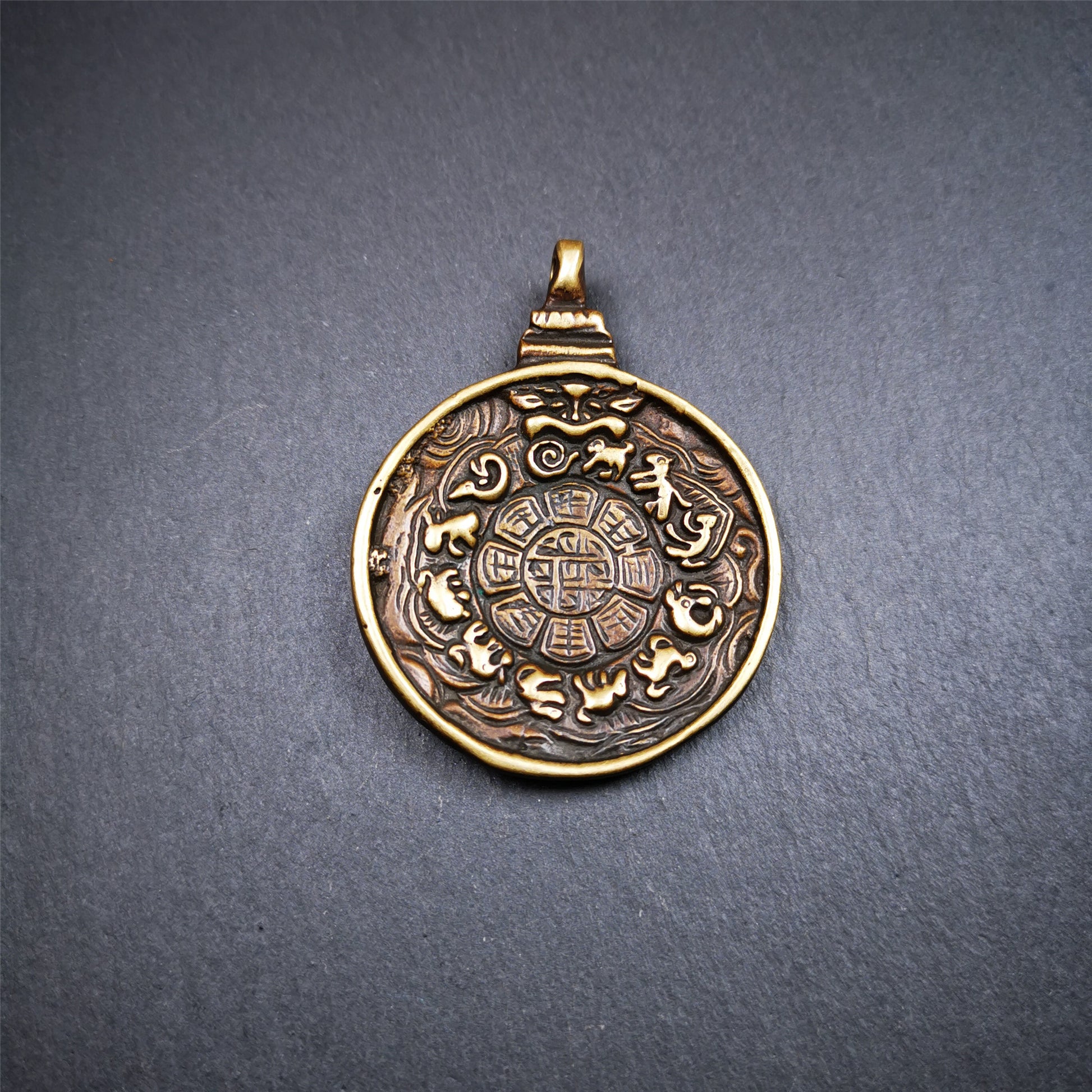 This unique Manjusri Melong Amulet was collected from Kathok Monastery,about 40 years old,bless by lama. It is round shape,made of brass,2.28 inch diameter.The front pattern is Tibetan Budhist calendar symbol - SIPAHO(srid pa ho),the back is Manjusri . You can make it into pendant or keychain, or just put it on your desk,as an ornament.