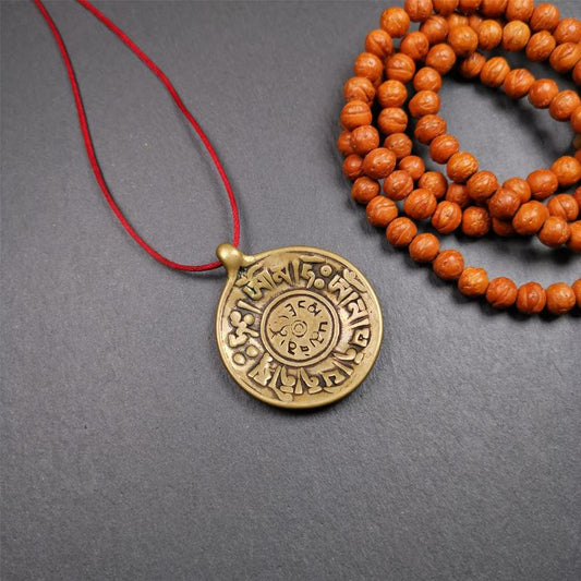 This Om badge amulet was collected from Yushu City Tibet,about 50 years old. It is round shape,made of lima brass, 1.65 inches,carved with mantra of chenrezig OM MANI PADME HUM. You can make it into a necklace, or a keychain, pendant