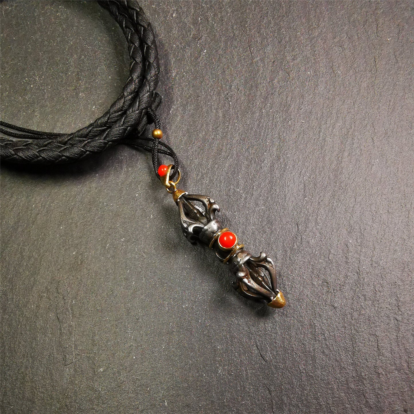 This unique vajra pendant was handmade by Tibetan craftsmen from Tibet in 1990's,from Hepo Town, Baiyu County, the birthplace of the famous Tibetan handicrafts. It is five-pronged Vajra,made of cold iron, 1.77 inch height.Comes with leather cord. You can make it a necklace, pendant, keychain, mala pendant, or just as an ornament on your desk.