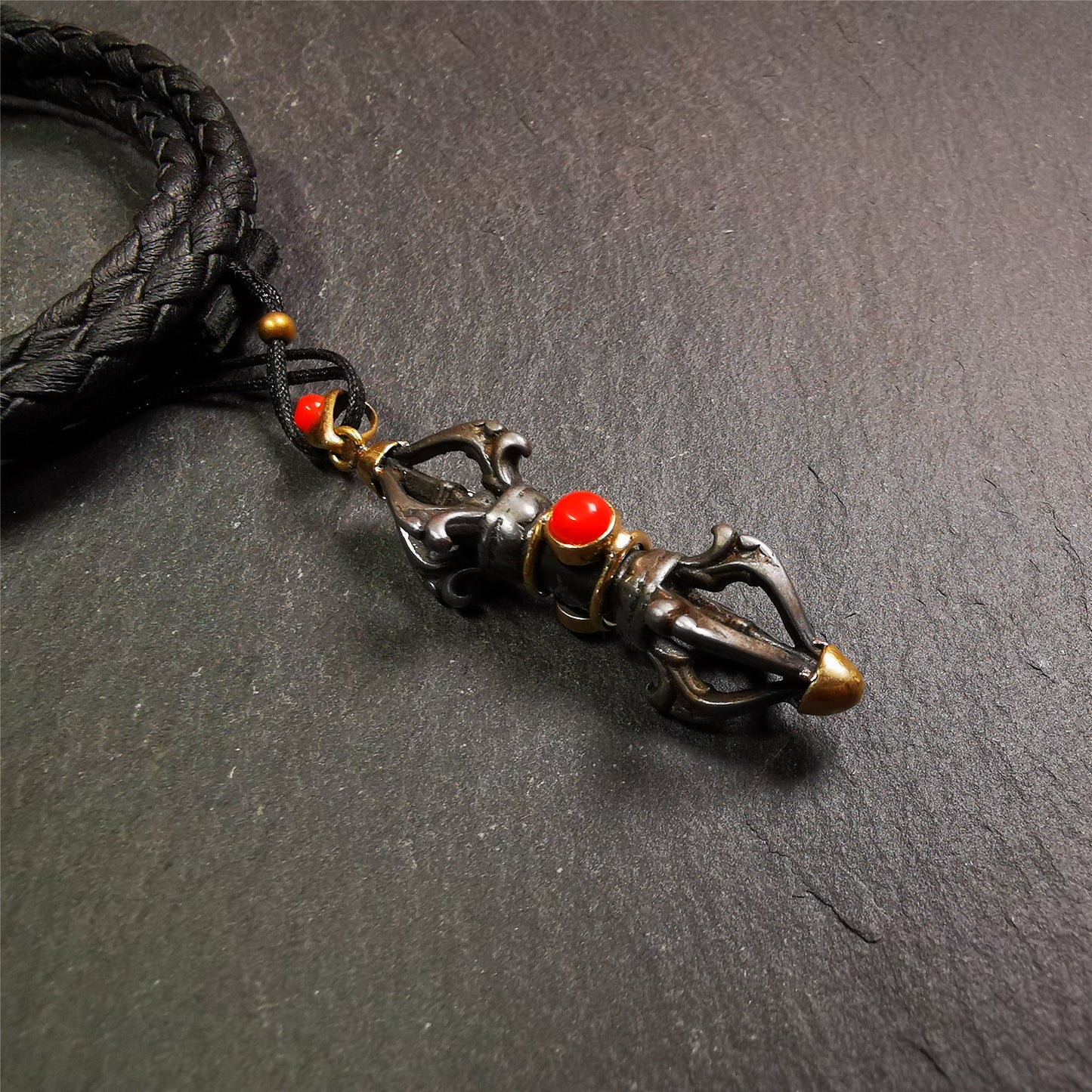 This unique vajra pendant was handmade by Tibetan craftsmen from Tibet in 1990's,from Hepo Town, Baiyu County, the birthplace of the famous Tibetan handicrafts. It is five-pronged Vajra,made of cold iron, 1.77 inch height.Comes with leather cord. You can make it a necklace, pendant, keychain, mala pendant, or just as an ornament on your desk.