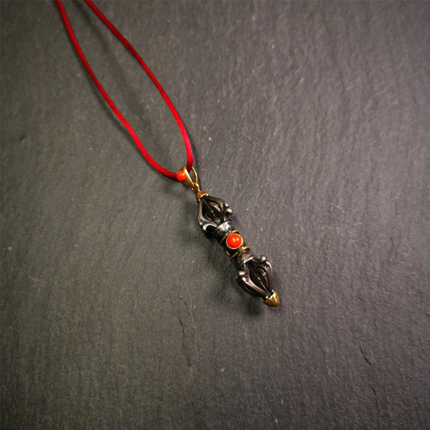 This unique vajra pendant was handmade by Tibetan craftsmen from Tibet in 1990's,from Hepo Town, Baiyu County, the birthplace of the famous Tibetan handicrafts. It is five-pronged Vajra,made of cold iron, 1.77 inch height.Comes with leather cord. You can make it a necklace, pendant, keychain, mala pendant, or just as an ornament on your desk.