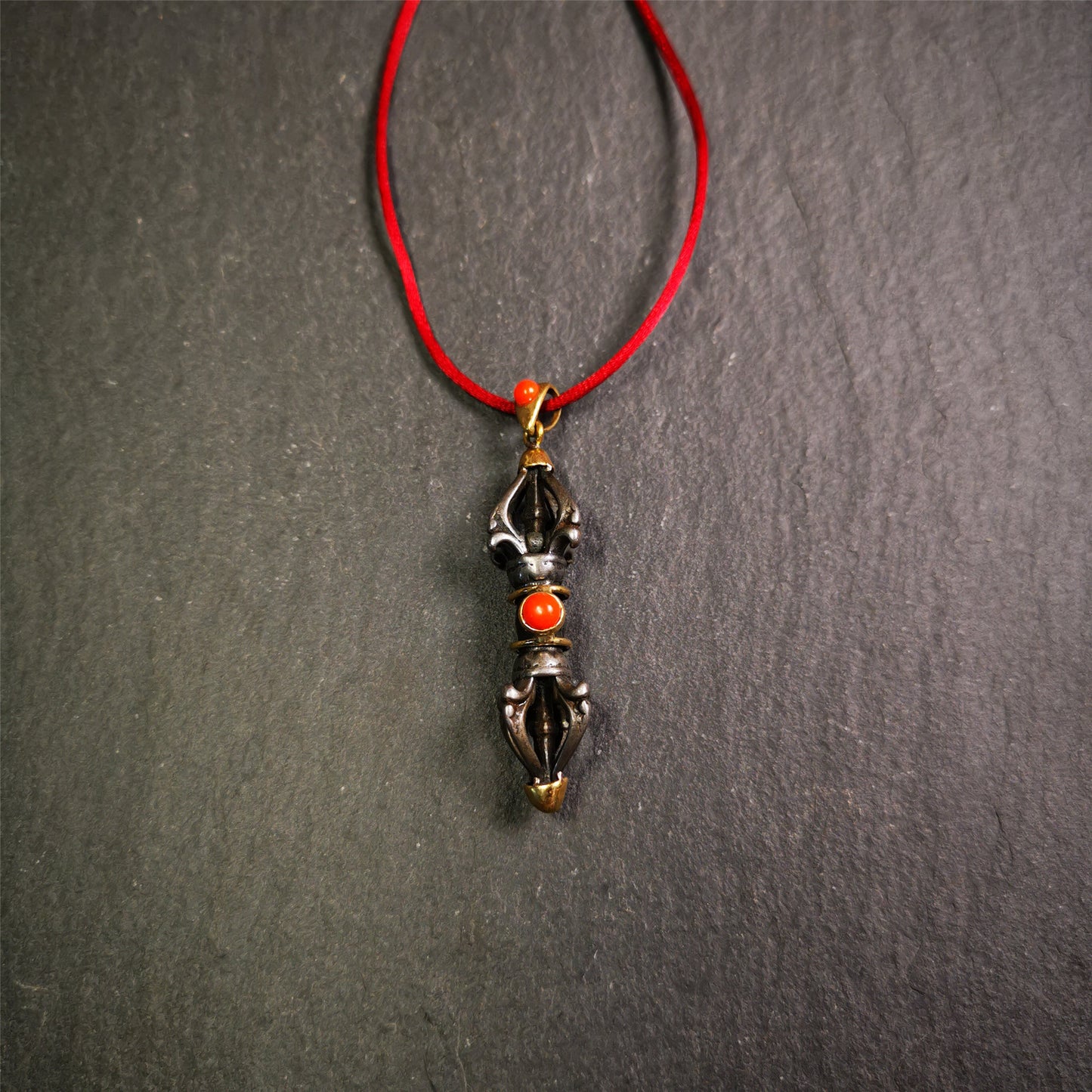 This unique vajra pendant was handmade by Tibetan craftsmen from Tibet in 1990's,from Hepo Town, Baiyu County, the birthplace of the famous Tibetan handicrafts. It is five-pronged Vajra,made of cold iron, 1.77 inch height.Comes with leather cord. You can make it a necklace, pendant, keychain, mala pendant, or just as an ornament on your desk.