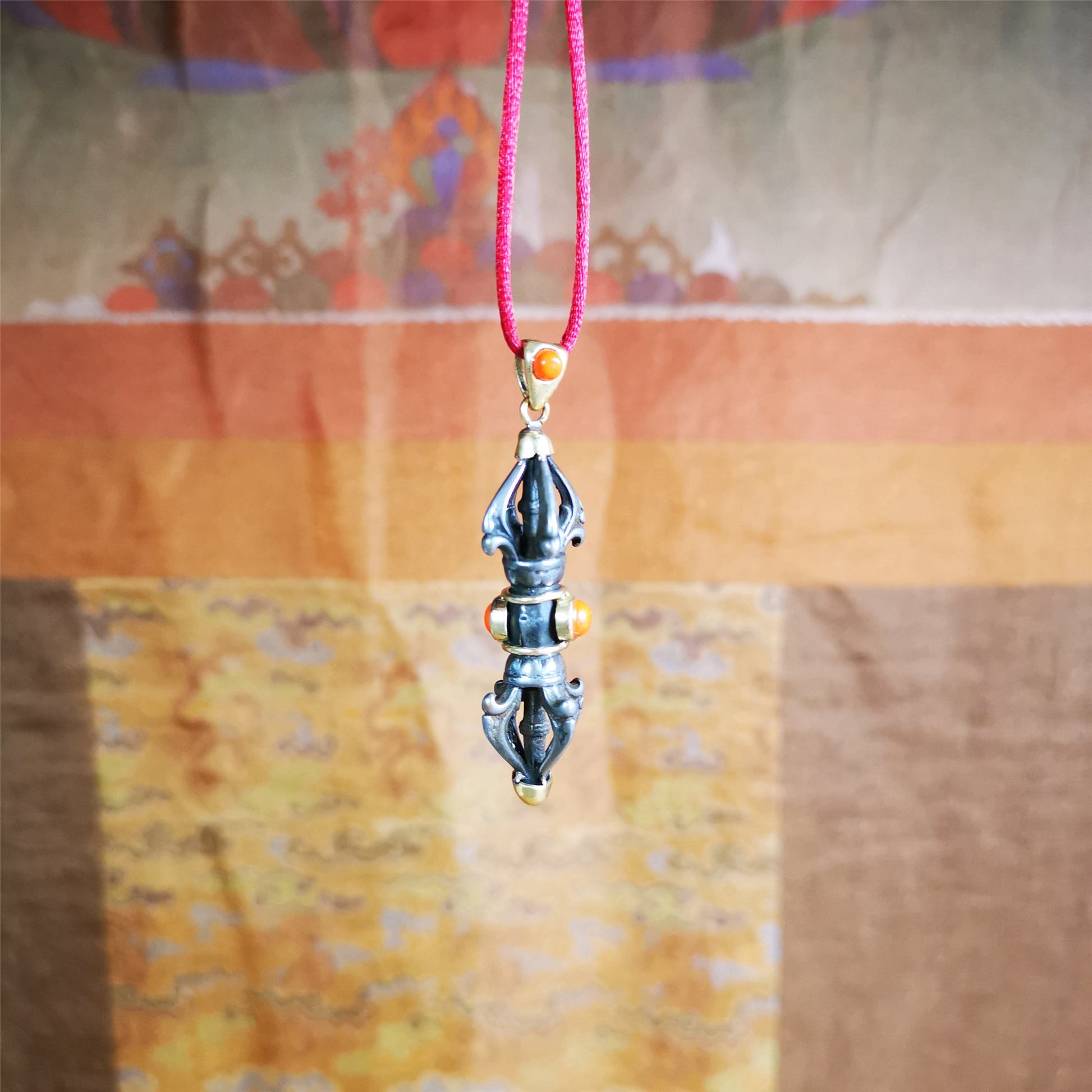 This unique vajra pendant was handmade by Tibetan craftsmen from Tibet in 1990's,from Hepo Town, Baiyu County, the birthplace of the famous Tibetan handicrafts. It is five-pronged Vajra,made of cold iron, 1.77 inch height.Comes with leather cord. You can make it a necklace, pendant, keychain, mala pendant, or just as an ornament on your desk.