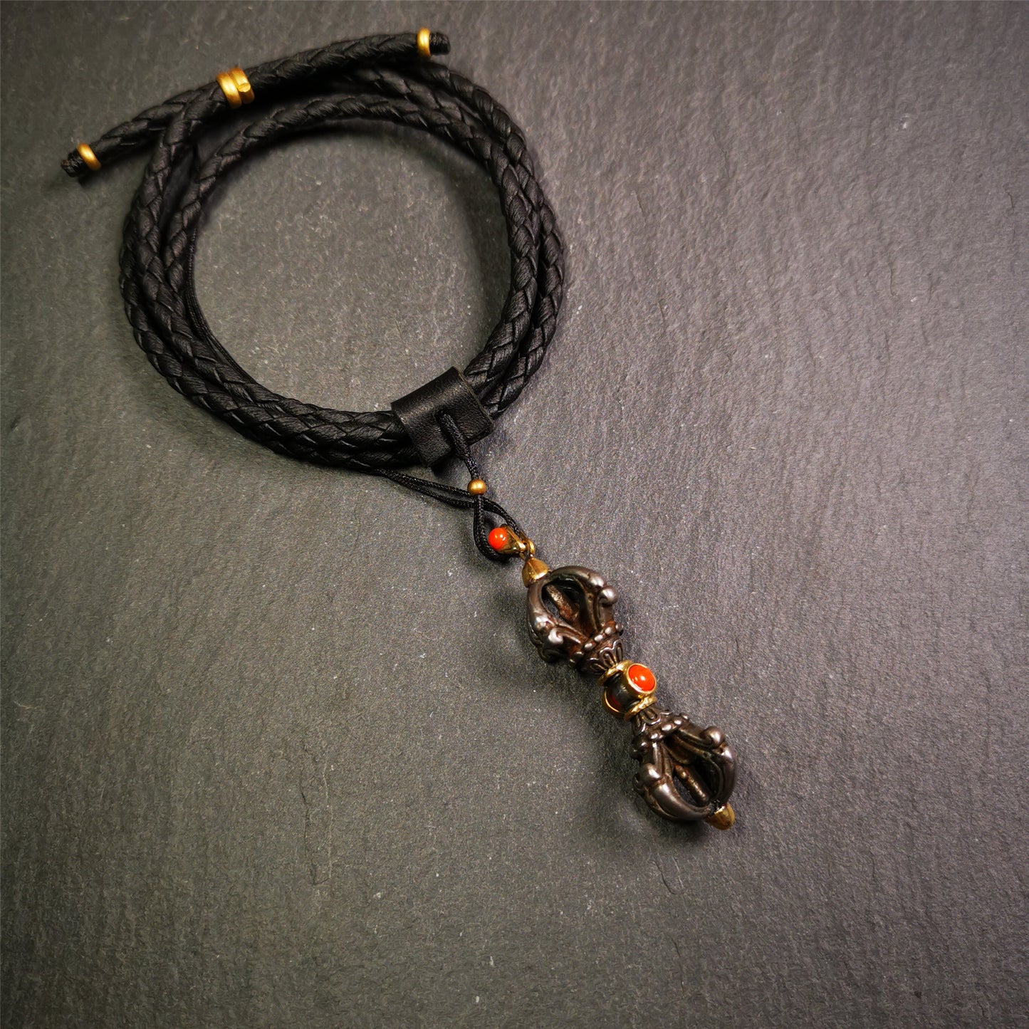 This unique vajra pendant was handmade by Tibetan craftsmen from Tibet in 1990's,from Hepo Town, Baiyu County, the birthplace of the famous Tibetan handicrafts. It is five-pronged Vajra,made of cold iron, 1.77 inch height.Comes with leather cord. You can make it a necklace, pendant, keychain, mala pendant, or just as an ornament on your desk.