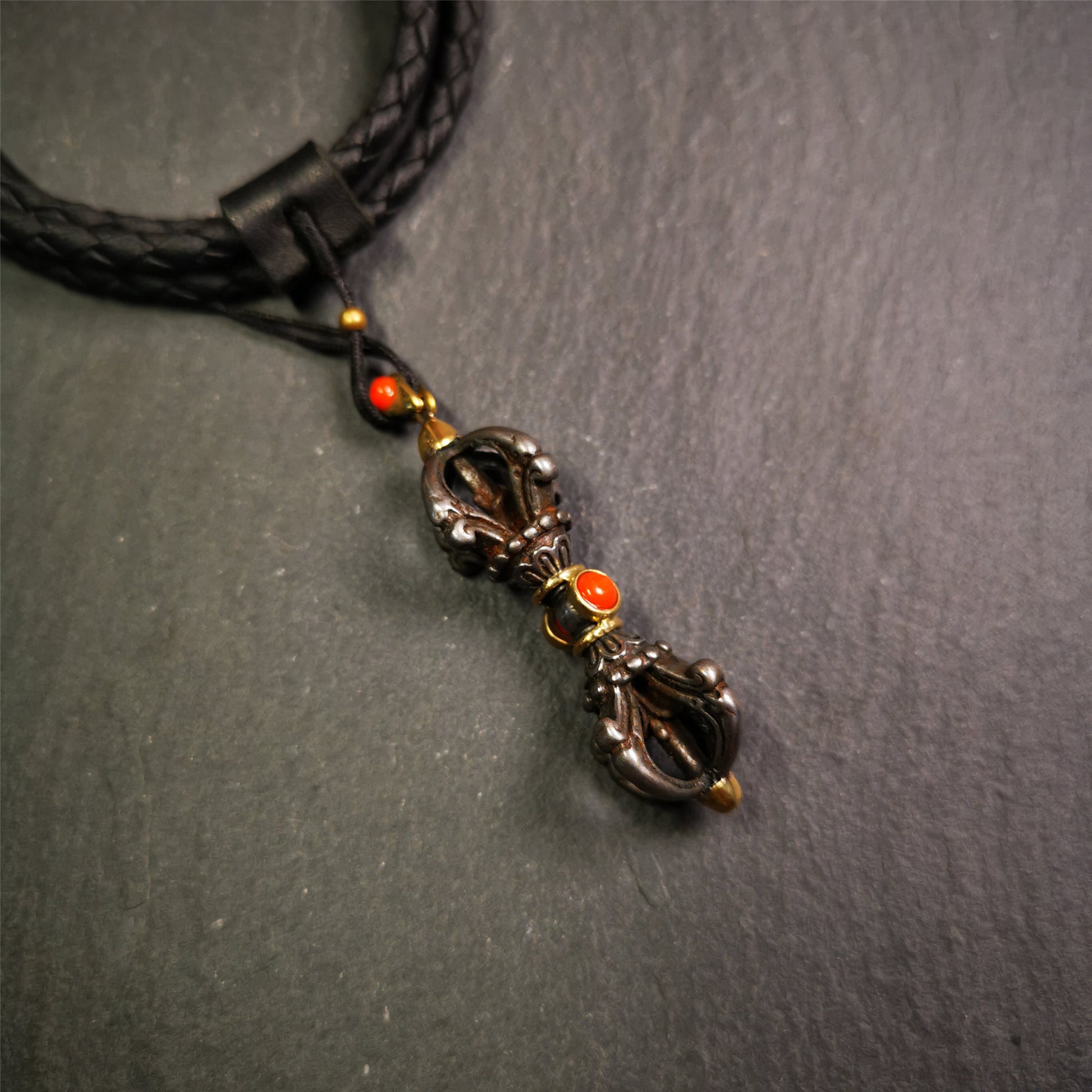 This unique vajra pendant was handmade by Tibetan craftsmen from Tibet in 1990's,from Hepo Town, Baiyu County, the birthplace of the famous Tibetan handicrafts. It is five-pronged Vajra,made of cold iron, 1.77 inch height.Comes with leather cord. You can make it a necklace, pendant, keychain, mala pendant, or just as an ornament on your desk.