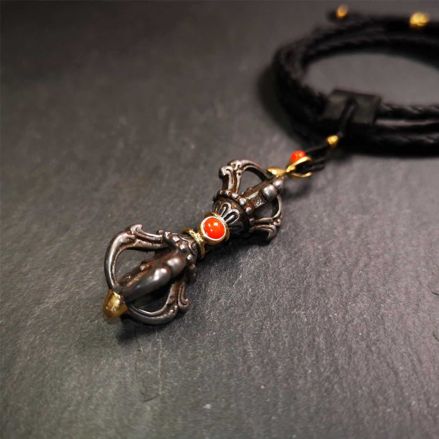 This unique vajra pendant was handmade by Tibetan craftsmen from Tibet in 1990's,from Hepo Town, Baiyu County, the birthplace of the famous Tibetan handicrafts. It is five-pronged Vajra,made of cold iron, 1.77 inch height.Comes with leather cord. You can make it a necklace, pendant, keychain, mala pendant, or just as an ornament on your desk.