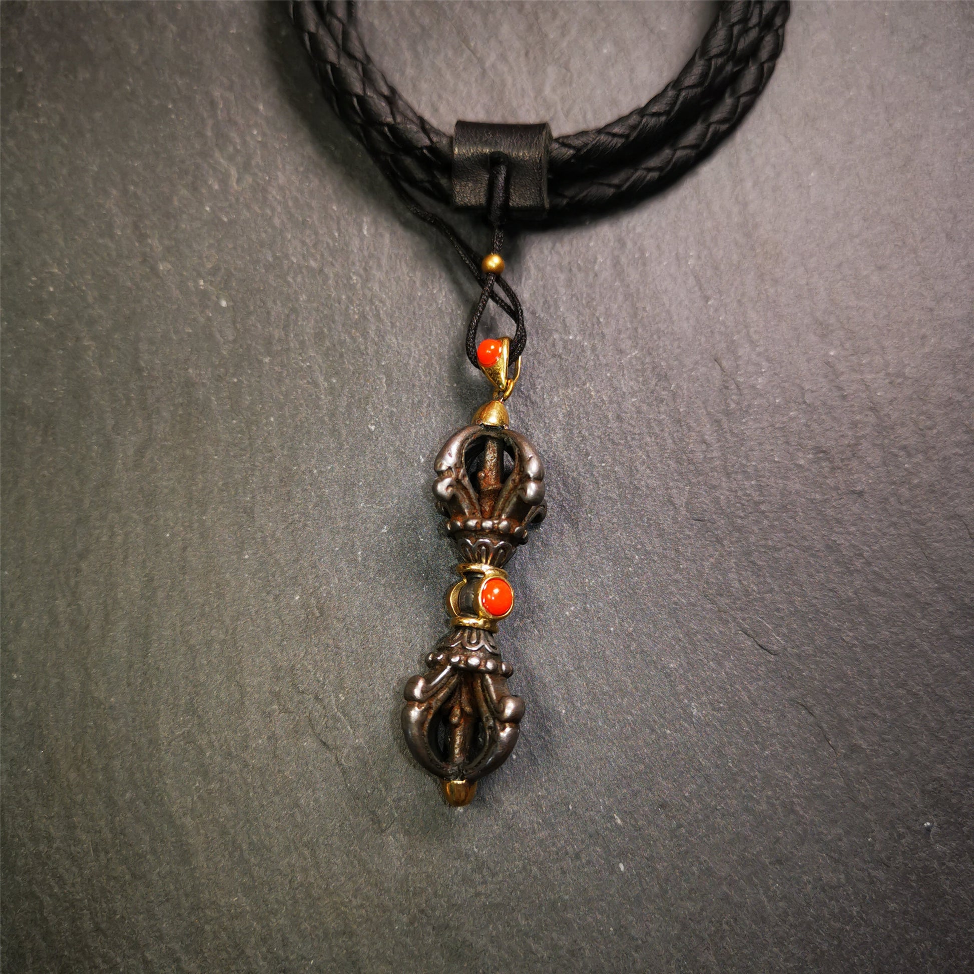 This unique vajra pendant was handmade by Tibetan craftsmen from Tibet in 1990's,from Hepo Town, Baiyu County, the birthplace of the famous Tibetan handicrafts. It is five-pronged Vajra,made of cold iron, 1.77 inch height.Comes with leather cord. You can make it a necklace, pendant, keychain, mala pendant, or just as an ornament on your desk.