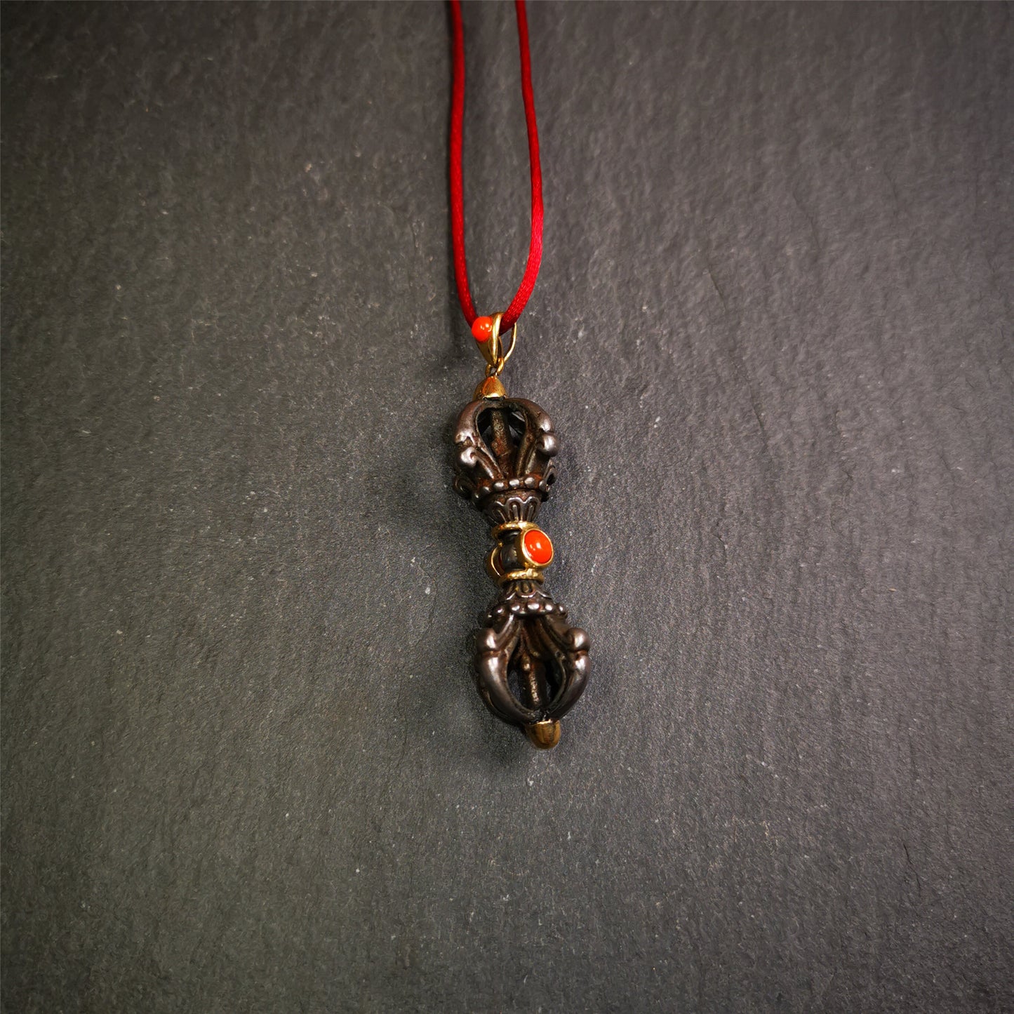 This unique vajra pendant was handmade by Tibetan craftsmen from Tibet in 1990's,from Hepo Town, Baiyu County, the birthplace of the famous Tibetan handicrafts. It is five-pronged Vajra,made of cold iron, 1.77 inch height.Comes with leather cord. You can make it a necklace, pendant, keychain, mala pendant, or just as an ornament on your desk.