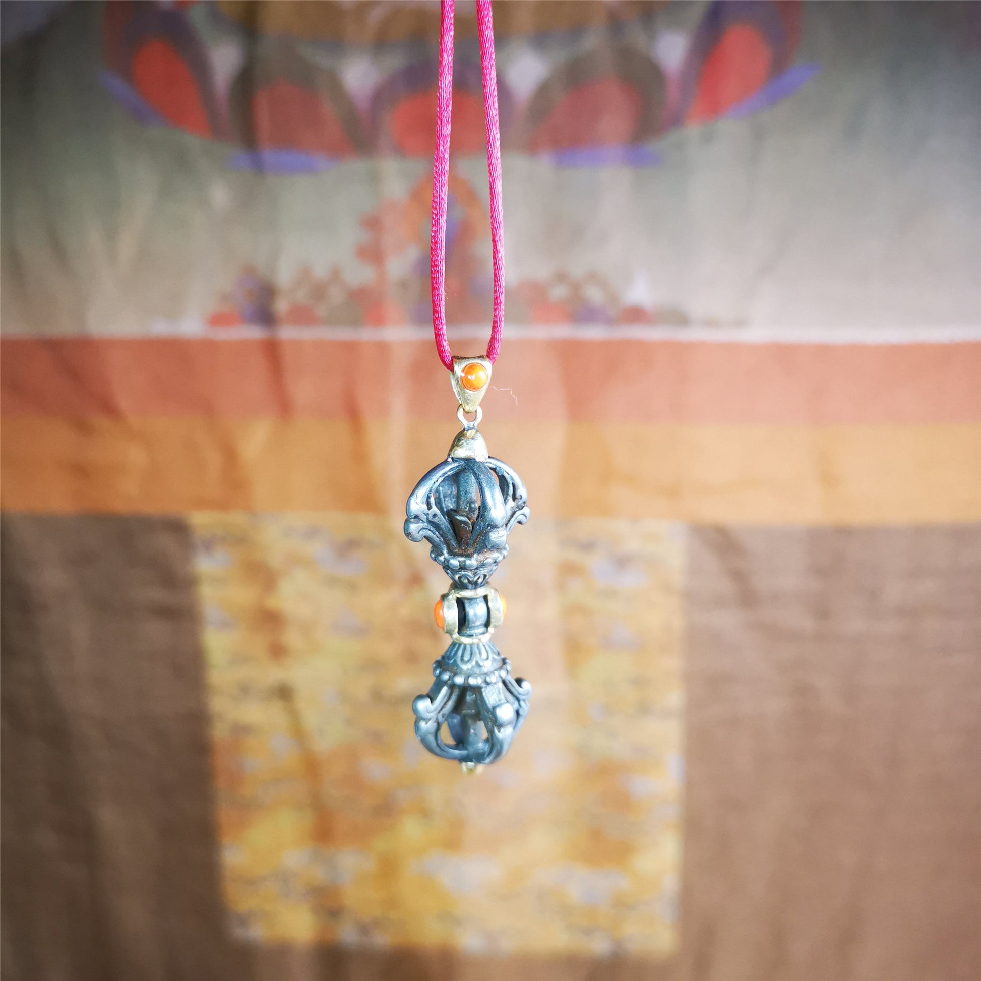 This unique vajra pendant was handmade by Tibetan craftsmen from Tibet in 1990's,from Hepo Town, Baiyu County, the birthplace of the famous Tibetan handicrafts. It is five-pronged Vajra,made of cold iron, 1.77 inch height.Comes with leather cord. You can make it a necklace, pendant, keychain, mala pendant, or just as an ornament on your desk.