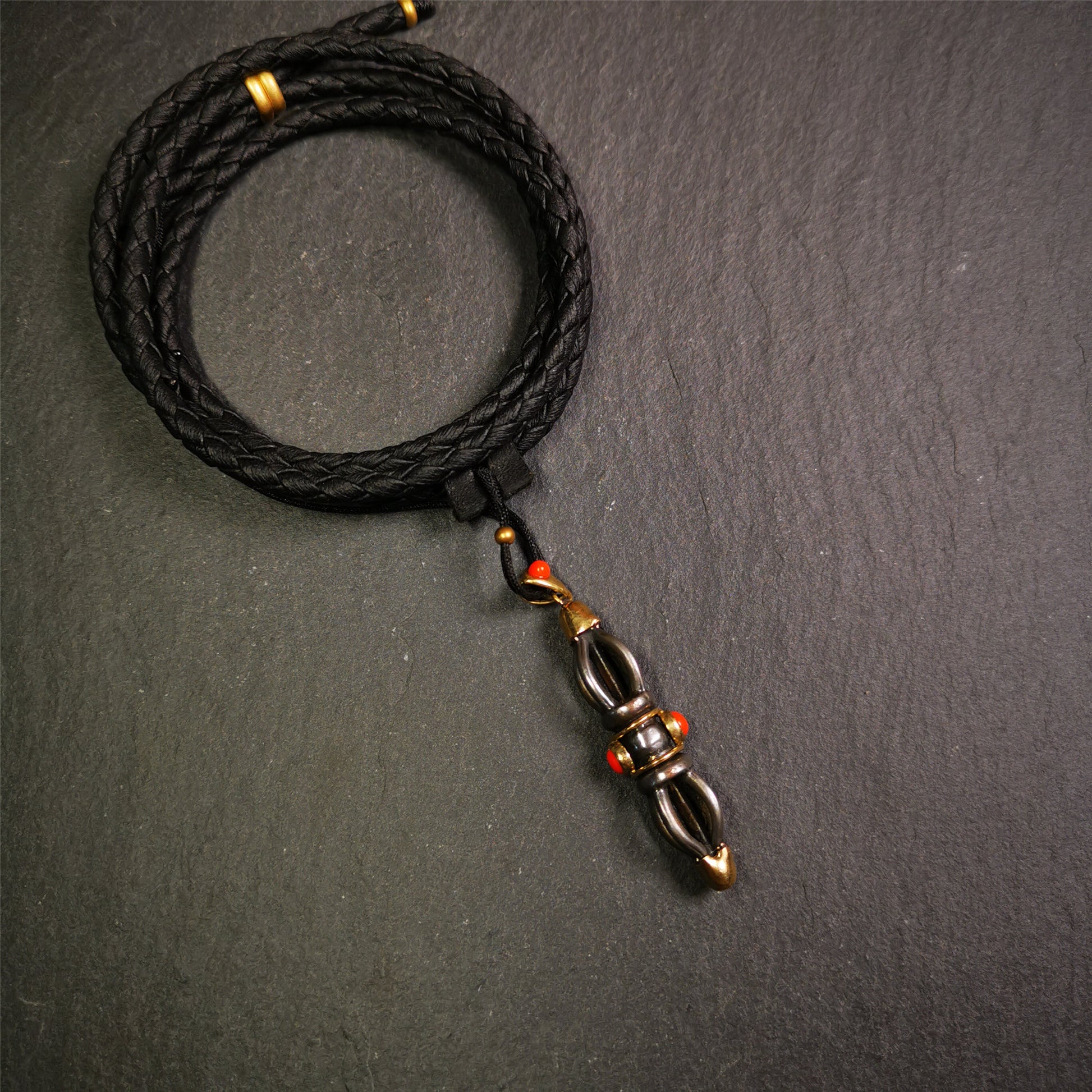 This unique vajra pendant was handmade by Tibetan craftsmen from Tibet in 1990s,from Hepo Town, Baiyu County, the birthplace of the famous Tibetan handicrafts. It is five-pronged Vajra,made of cold iron, 1.77 inch height.Comes with leather cord.