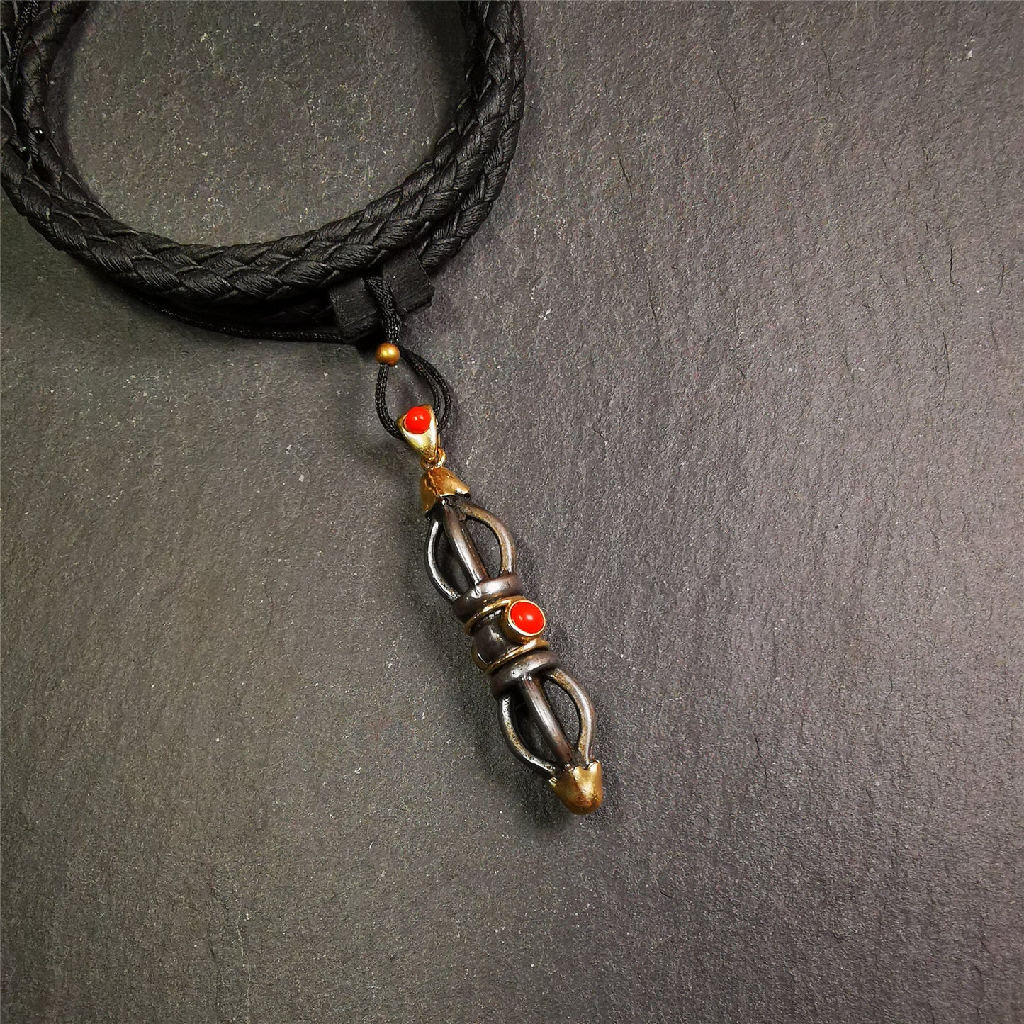 This unique vajra pendant was handmade by Tibetan craftsmen from Tibet in 1990s,from Hepo Town, Baiyu County, the birthplace of the famous Tibetan handicrafts. It is five-pronged Vajra,made of cold iron, 1.77 inch height.Comes with leather cord.