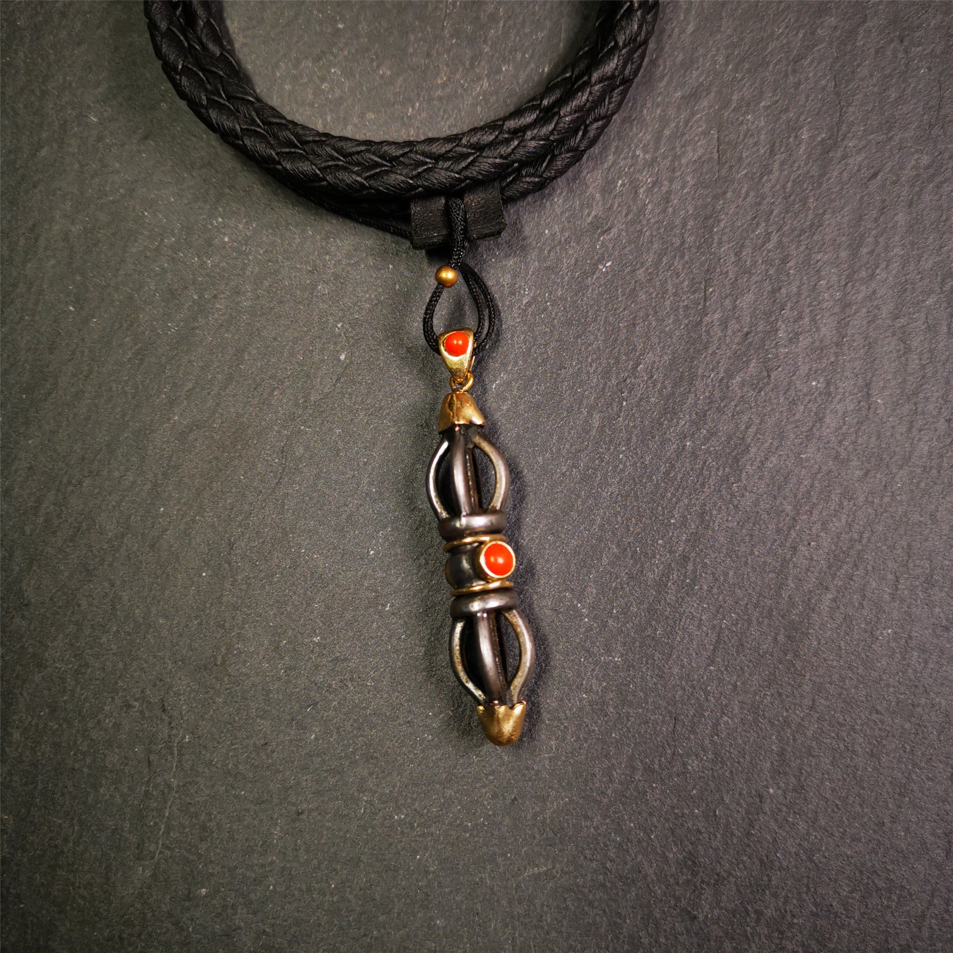 This unique vajra pendant was handmade by Tibetan craftsmen from Tibet in 1990s,from Hepo Town, Baiyu County, the birthplace of the famous Tibetan handicrafts. It is five-pronged Vajra,made of cold iron, 1.77 inch height.Comes with leather cord.