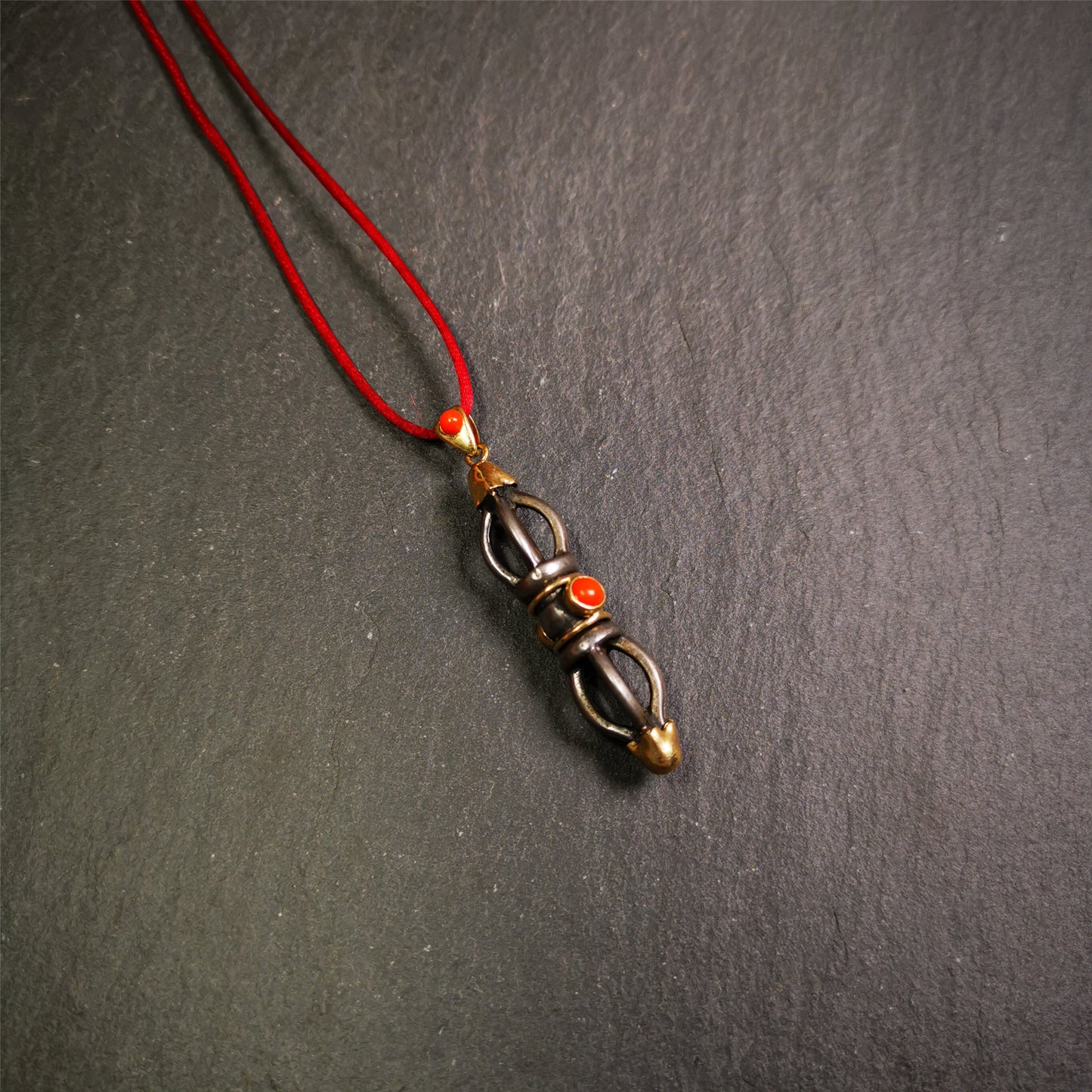 This unique vajra pendant was handmade by Tibetan craftsmen from Tibet in 1990s,from Hepo Town, Baiyu County, the birthplace of the famous Tibetan handicrafts. It is five-pronged Vajra,made of cold iron, 1.77 inch height.Comes with leather cord.