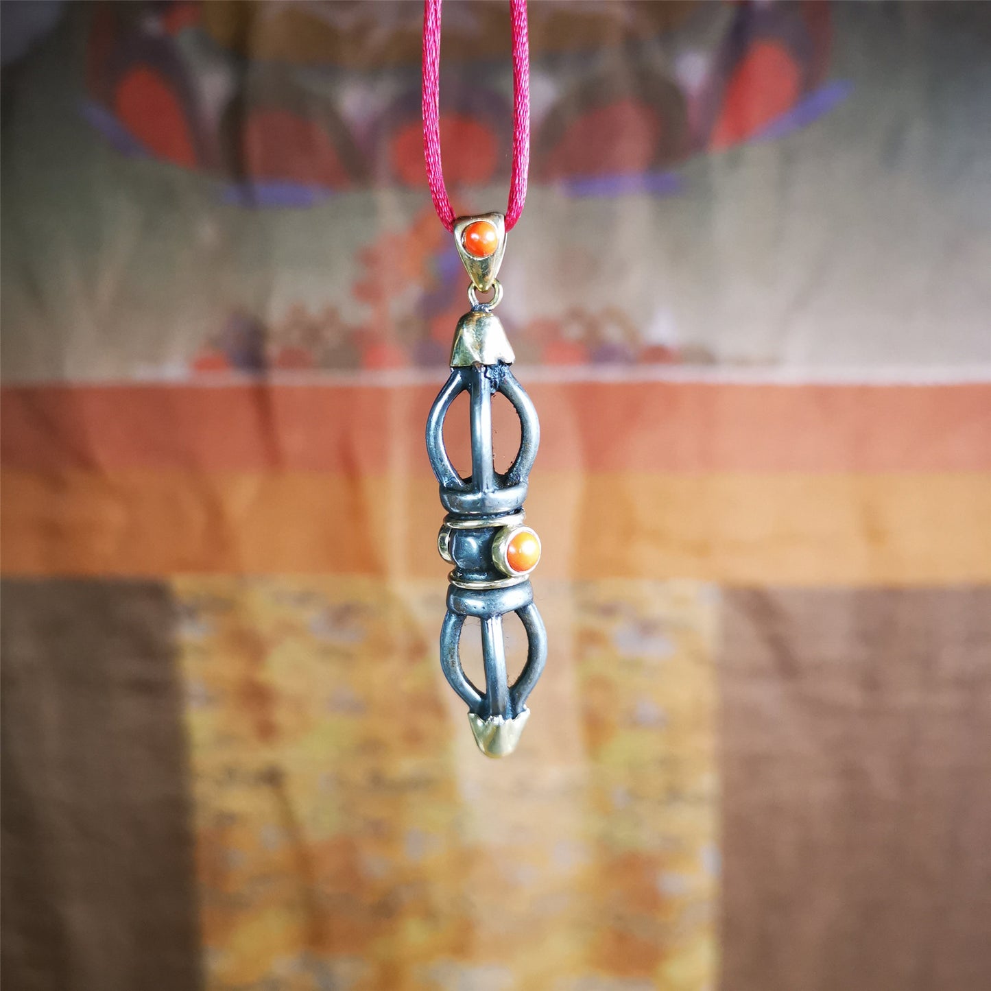 This unique vajra pendant was handmade by Tibetan craftsmen from Tibet in 1990s,from Hepo Town, Baiyu County, the birthplace of the famous Tibetan handicrafts. It is five-pronged Vajra,made of cold iron, 1.77 inch height.Comes with leather cord.