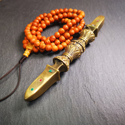 These beautiful vajra were handmade by Tibetan craftsmen from Tibet in 1990s,from Hepo Town, Baiyu County, the birthplace of the famous Tibetan handicrafts. It is five-pronged vajra,made of brass,inlaid agate,yellow color,6.5 inches length.