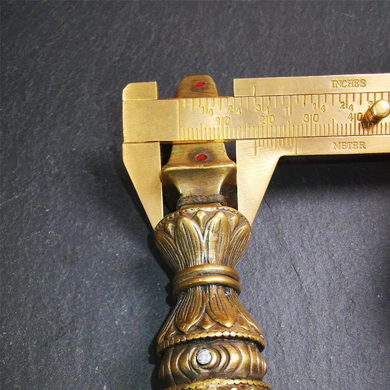 These beautiful vajra were handmade by Tibetan craftsmen from Tibet in 1990s,from Hepo Town, Baiyu County, the birthplace of the famous Tibetan handicrafts. It is five-pronged vajra,made of brass,inlaid agate,yellow color,6.5 inches length.