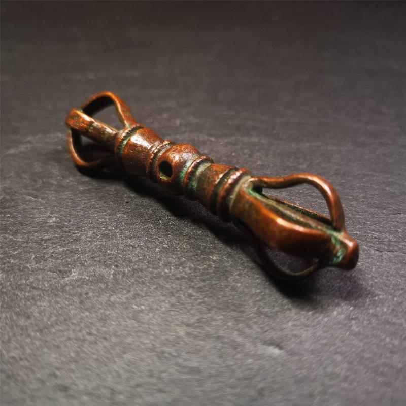 This unique vajra pendant was handmade by Tibetan craftsmen from Tibet in 1990s,from Hepo Town, Baiyu County, the birthplace of the famous Tibetan handicrafts. It is five-pronged Vajra,made of copper, brown color,2.76 inches length.