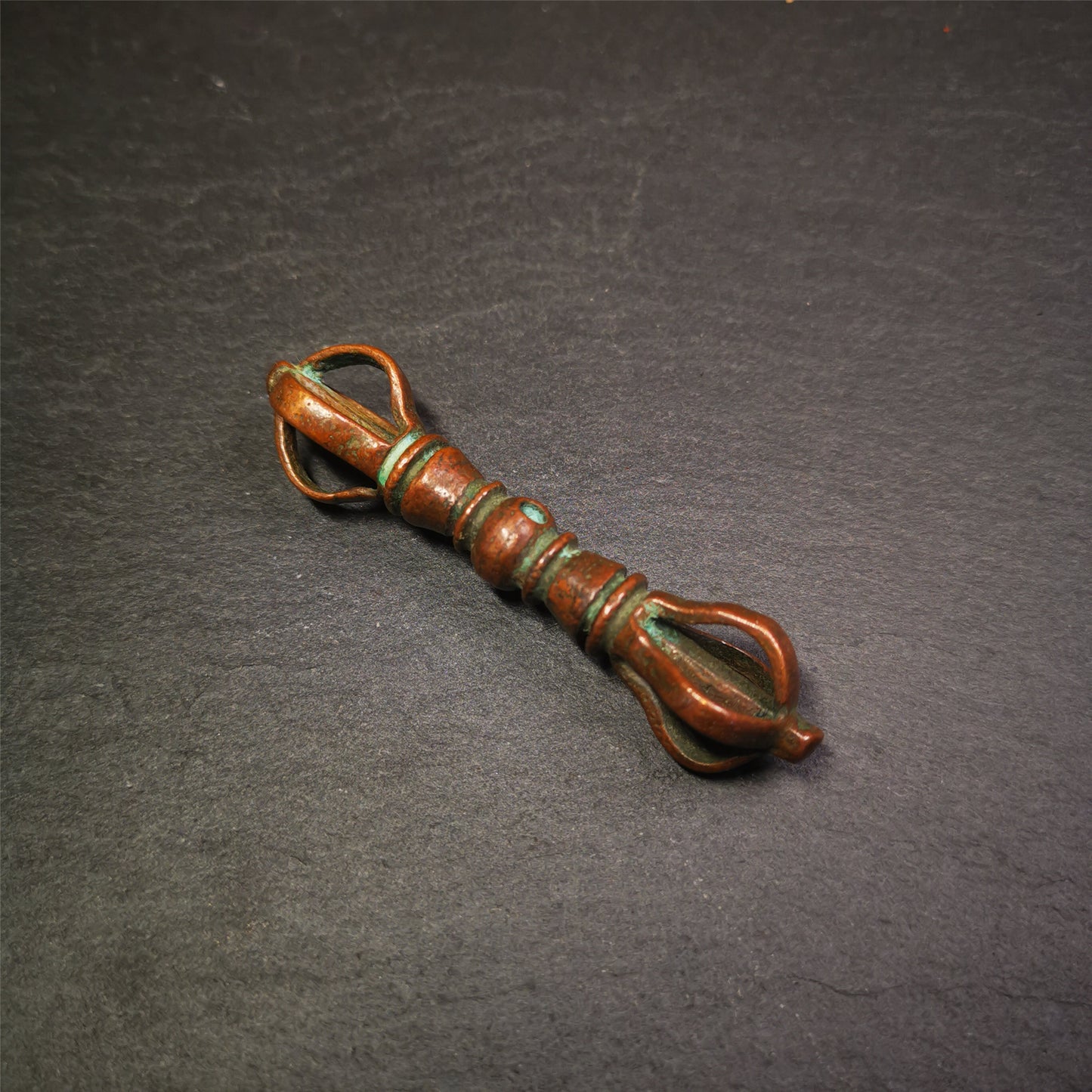 This unique vajra pendant was handmade by Tibetan craftsmen from Tibet in 1990s,from Hepo Town, Baiyu County, the birthplace of the famous Tibetan handicrafts. It is five-pronged Vajra,made of copper, brown color,2.76 inches length.