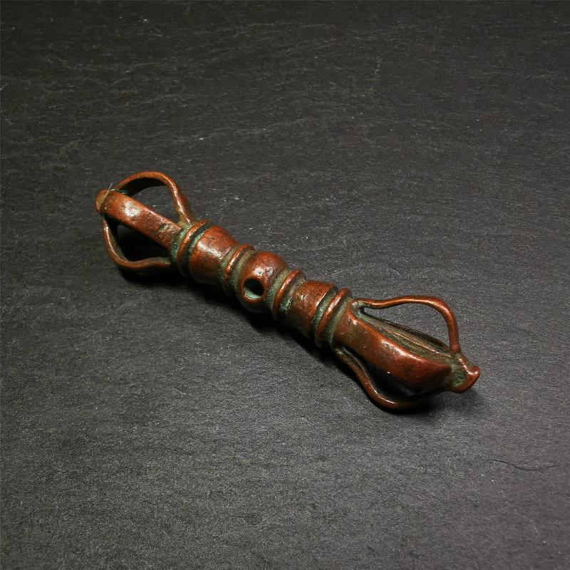 This unique vajra pendant was handmade by Tibetan craftsmen from Tibet in 1990s,from Hepo Town, Baiyu County, the birthplace of the famous Tibetan handicrafts. It is five-pronged Vajra,made of copper, brown color,2.76 inches length.