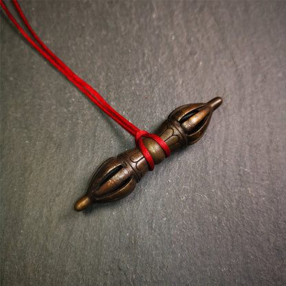 This unique vajra pendant was handmade by Tibetan craftsmen from Tibet in 1990s,from Hepo Town, Baiyu County, the birthplace of the famous Tibetan handicrafts. It is nine-pronged Vajra,made of copper, brown color,2.76 inches length.