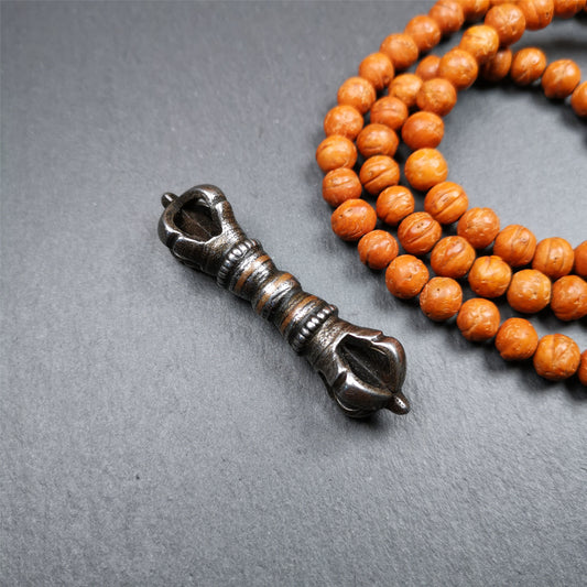 This unique vajra pendant was handmade by Tibetan craftsmen from Tibet in 1990s,from Hepo Town, Baiyu County, the birthplace of the famous Tibetan handicrafts. It is five - pronged Vajra,made of cold iron, black color,2.36 inches length.