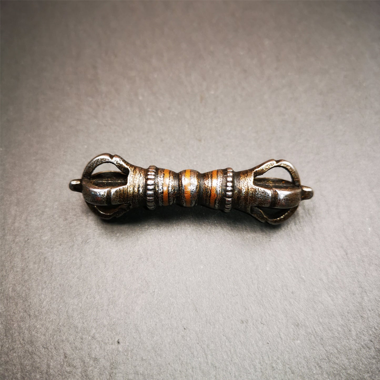 This unique vajra pendant was handmade by Tibetan craftsmen from Tibet in 1990s,from Hepo Town, Baiyu County, the birthplace of the famous Tibetan handicrafts. It is five - pronged Vajra,made of cold iron, black color,2.36 inches length.