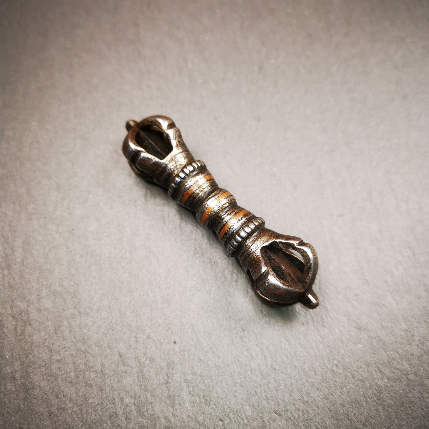 This unique vajra pendant was handmade by Tibetan craftsmen from Tibet in 1990s,from Hepo Town, Baiyu County, the birthplace of the famous Tibetan handicrafts. It is five - pronged Vajra,made of cold iron, black color,2.36 inches length.