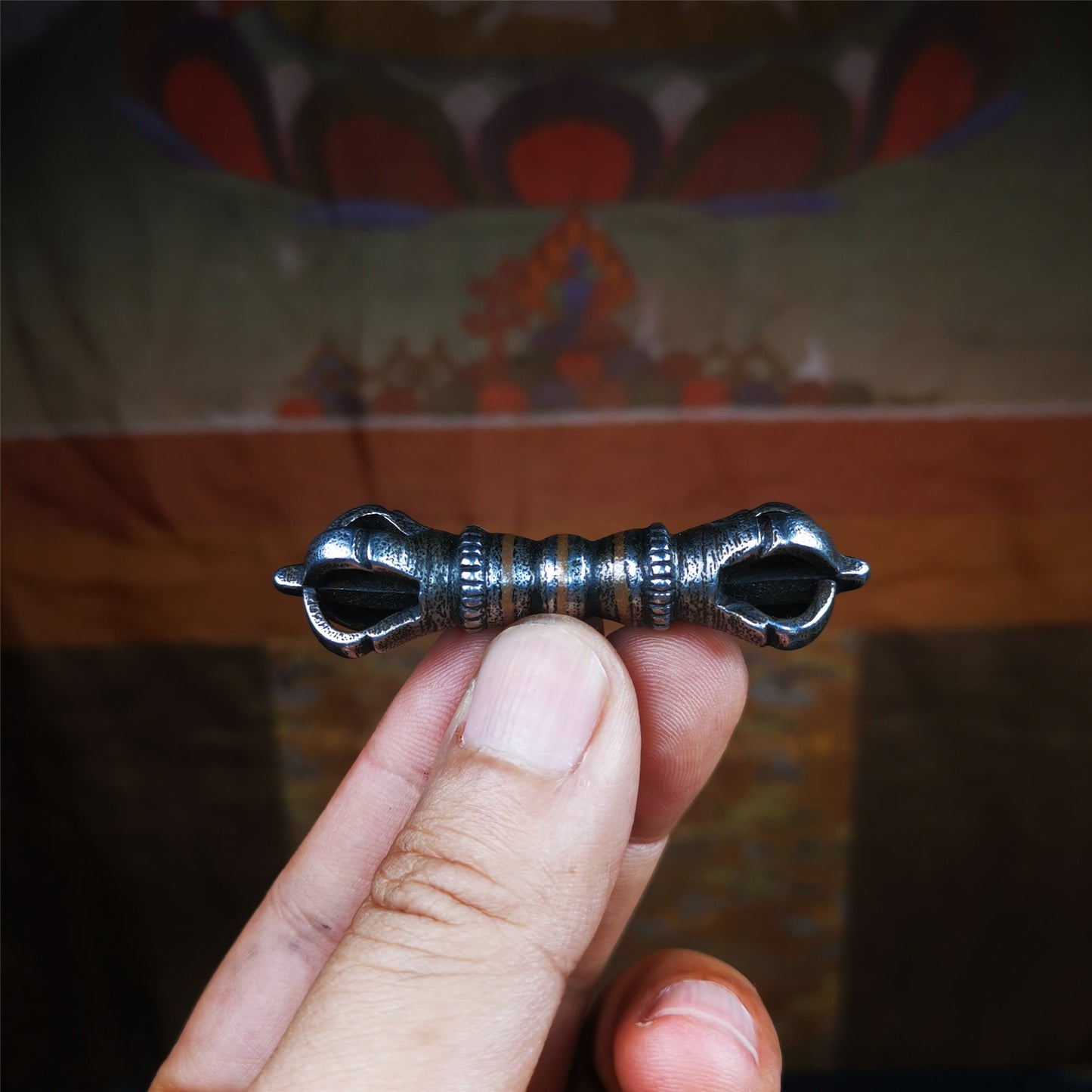 This unique vajra pendant was handmade by Tibetan craftsmen from Tibet in 1990s,from Hepo Town, Baiyu County, the birthplace of the famous Tibetan handicrafts. It is five - pronged Vajra,made of cold iron, black color,2.36 inches length.