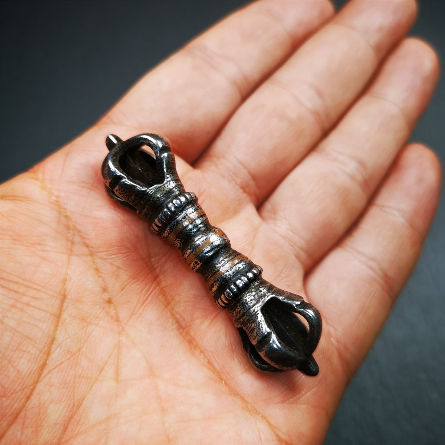 This unique vajra pendant was handmade by Tibetan craftsmen from Tibet in 1990s,from Hepo Town, Baiyu County, the birthplace of the famous Tibetan handicrafts. It is five - pronged Vajra,made of cold iron, black color,2.36 inches length.