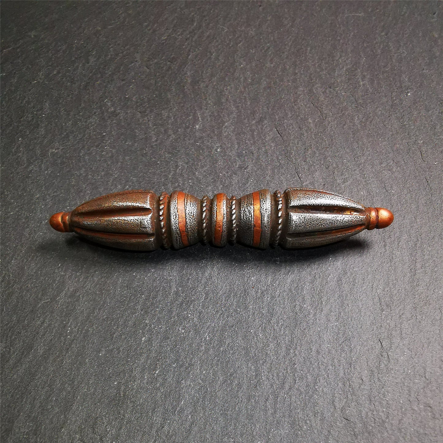 These beautiful vajra dorje were handmade by Tibetan craftsmen from Tibet in 1990's,from Hepo Town, Baiyu County, the birthplace of the famous Tibetan handicrafts. It is seven-pronged vajra,made of cold iron,inlaid copper wire,black color.