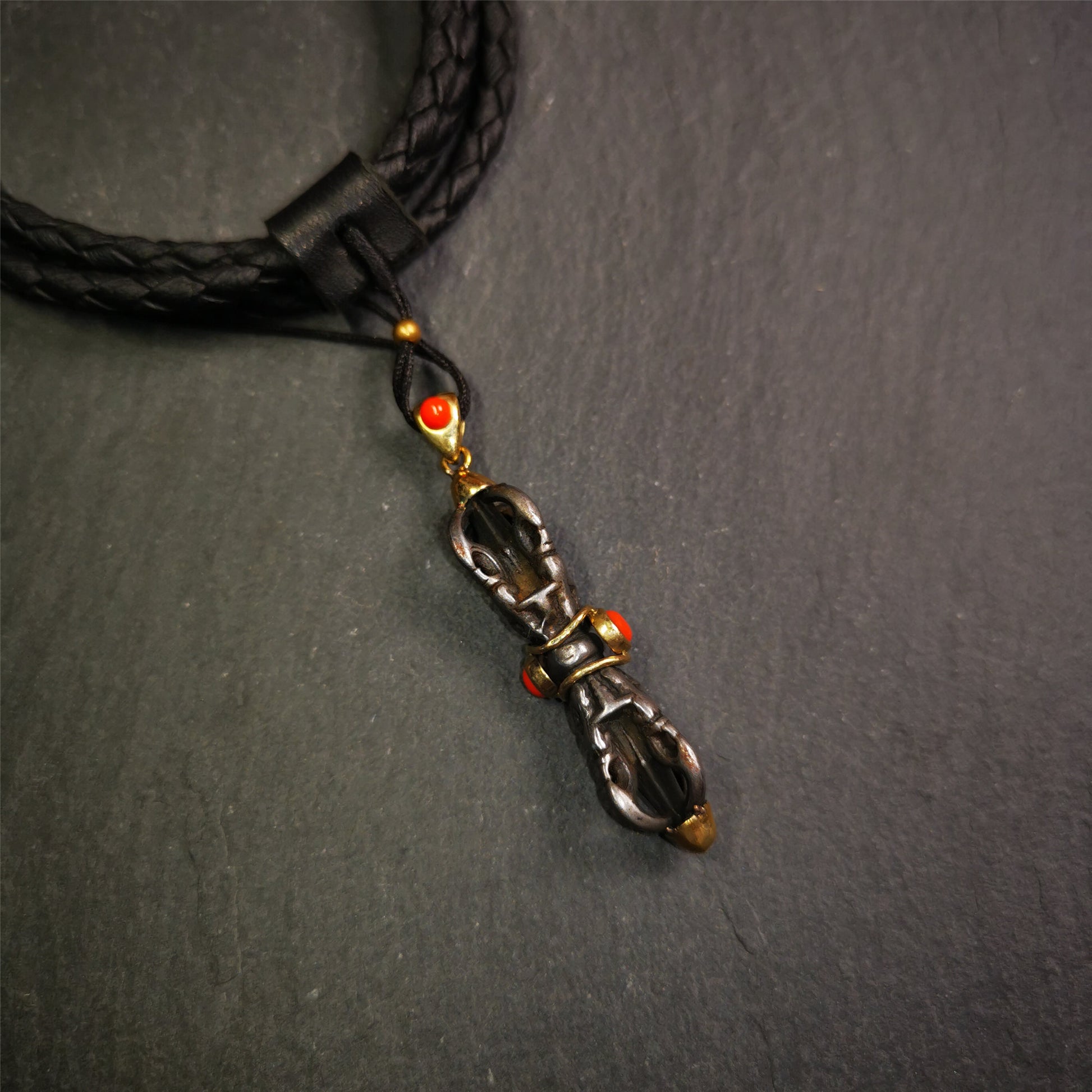 This unique vajra pendant was handmade by Tibetan craftsmen from Tibet in 1990's,from Hepo Town, Baiyu County, the birthplace of the famous Tibetan handicrafts. It is five-pronged Vajra,made of cold iron, 1.77 inch height.Comes with leather cord. You can make it a necklace, pendant, keychain, mala pendant, or just as an ornament on your desk.