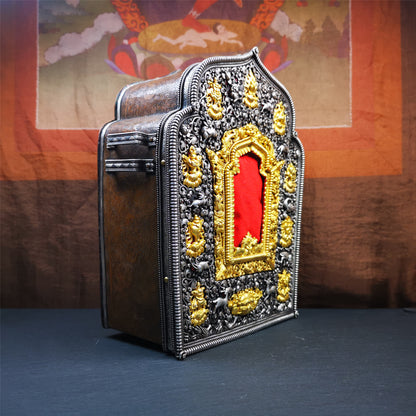 This large Gau shrine was handcrafted by Tibetan artisans from Hepo Township, Baiyu County. Each exquisite pattern on it is meticulously hand-carved,and it is embellished with the technique of gold inlay, with pure silver inlaid on the red copper material and gold-plated on the pure silver material.Its theme is Astamangala, and it features 10 mythical creatures traversing a silver-patterned meadow. The interior space of the box is quite spacious, large enough to accommodate a 12 * 8 cm Buddha statue.