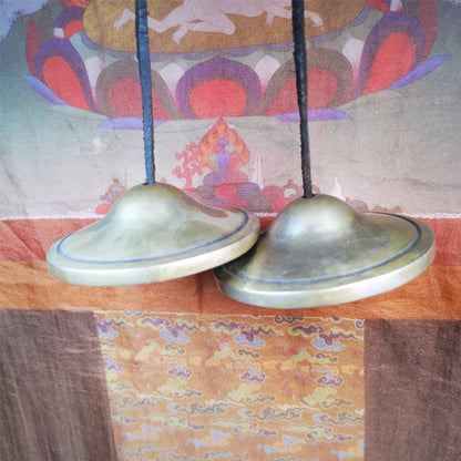 This tingsha bell set was handmade in Nepal,using traditional techniques and materials. It was made of copper,8.3cm diameter,with pure, clear and resonant,good for meditation. Come with tingsha case.