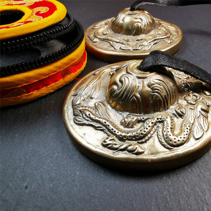 This tingsha bell set was handmade in Nepal,using traditional techniques and materials. It was made of bronze,carved om mani padme hum mantra,6.8cm diameter,with pure, clear and resonant,good for meditation. Come with tingsha case.