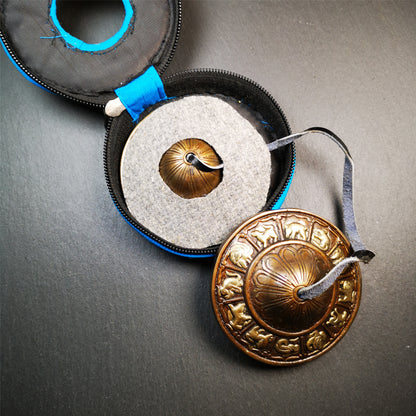 This tingsha bell set was handmade in Nepal,using traditional techniques and materials. It was made of bronze,carved 12 tibetan zodiac pattern,8.3cm diameter,with pure, clear and resonant,good for meditation. Come with tingsha case.
