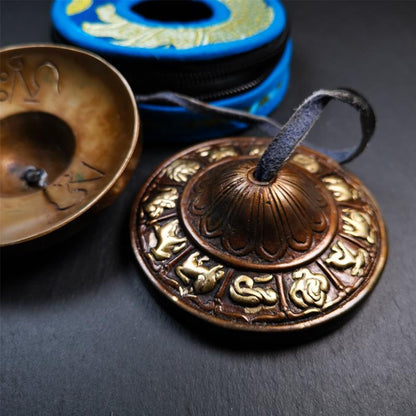 This tingsha bell set was handmade in Nepal,using traditional techniques and materials. It was made of bronze,carved 12 tibetan zodiac pattern,8.3cm diameter,with pure, clear and resonant,good for meditation. Come with tingsha case.