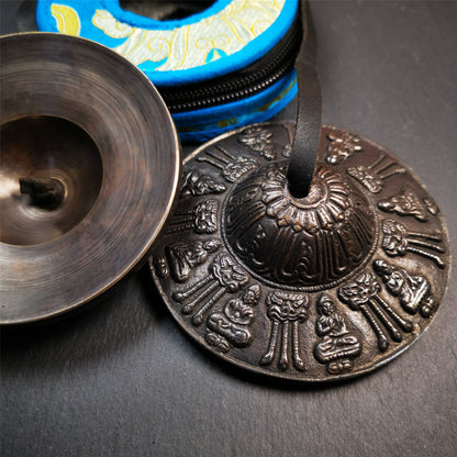 This tingsha bell set was handmade in Nepal,using traditional techniques and materials. It was made of bronze,9cm diameter,carved eight buddha and kirtimukha statue,with pure, clear and resonant,good for meditation. Come with tingsha case.