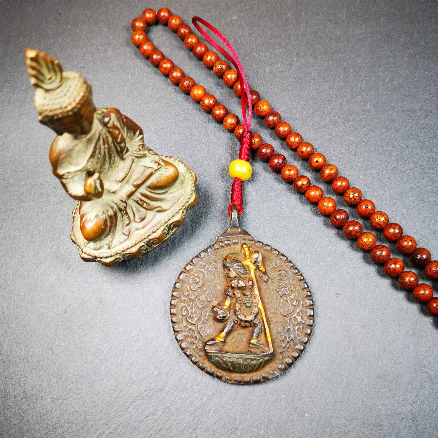 This unique Troma Nagmo Melong Amulet was collected from Goinqên Monastery,about 40 years old,consecrated and blessed by lama. It is round shape,made of thokcha,2.2 inch diameter,the front pattern is Tibetan Budhist calendar symbol - SIPAHO(srid pa ho),and the back is Troma Nagmo. You can make it into pendant or keychain, or just put it on your desk,as an ornament.